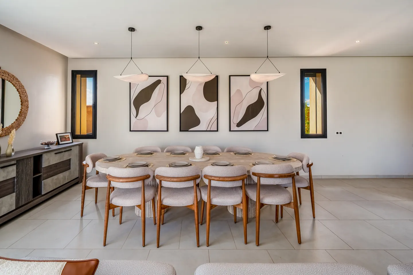 Dining room with pendant lights and abstract art