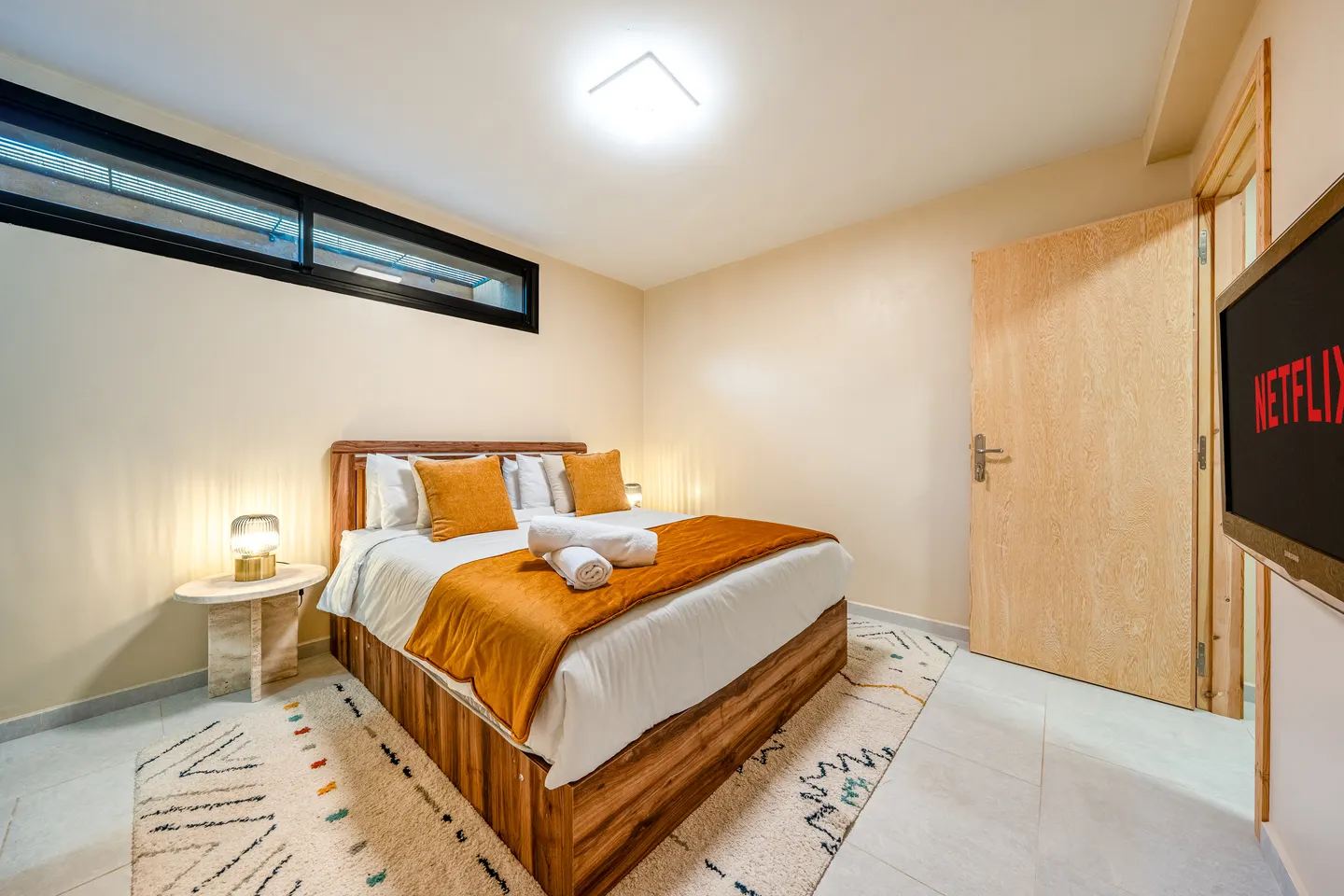 Bedroom 6, lower level: queen bed with warm bedding, no air conditioning