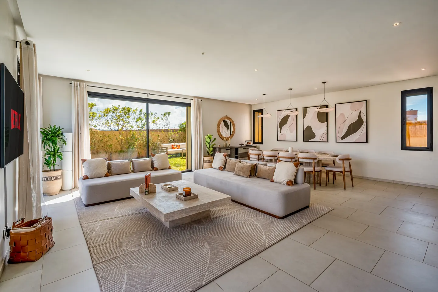 Living room with large sofas opening onto the garden