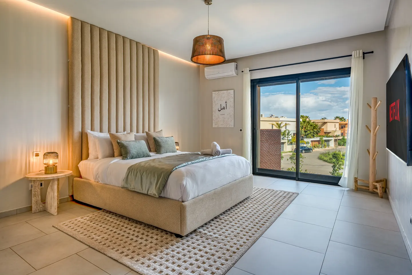 Bedroom 5, upstairs: queen bed, sage bedding, window on the garden