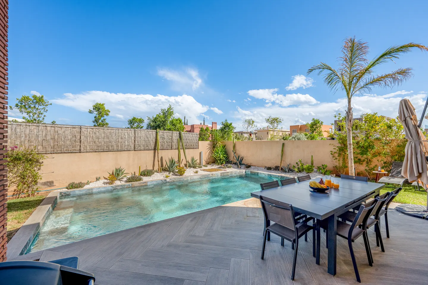 Outdoor dining table for ten beside the pool