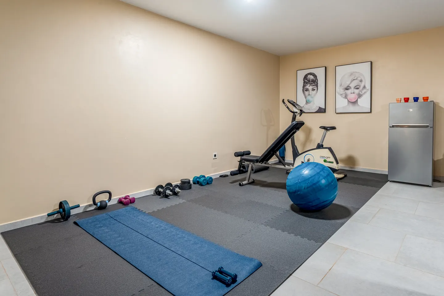 Fitness corner with mats, weights and exercise bike