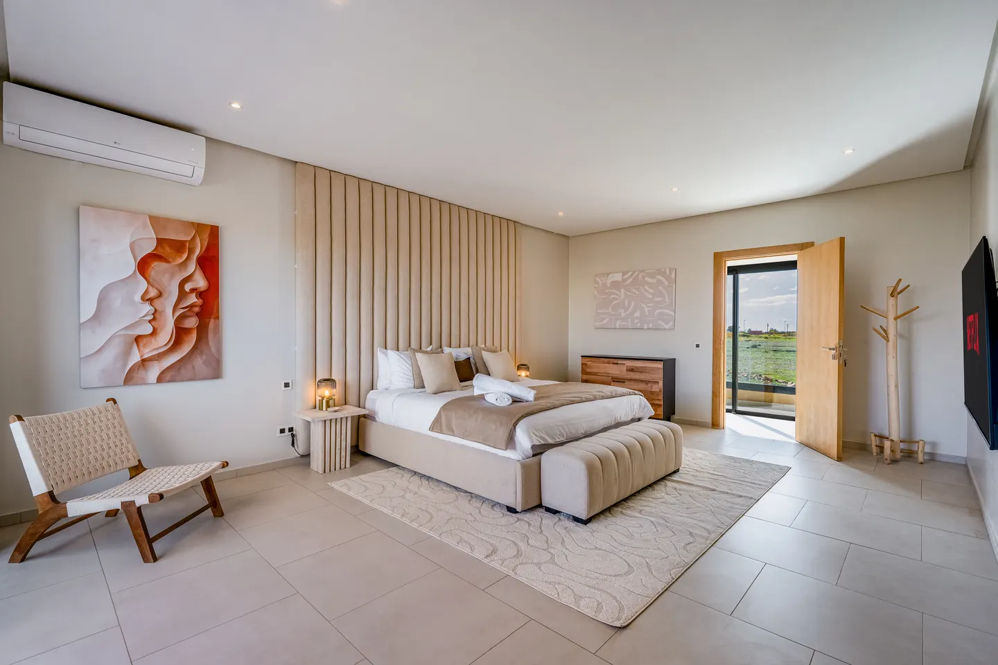 Bedroom 1, family suite upstairs: king bed, air conditioning, door to the balcony